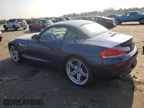 2014 BMW Z4 sDrive35is with VIN WBALM1C57EE634167, listed as a Copart auction lot 69088044 with 68,620 mi miles and Salvage title. Bid and sale history available at DreamBid. Image 2.