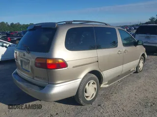2000 Toyota Sienna LE with VIN 4T3ZF13C1YU301224, listed as a IAAI auction lot 42176695 with 203,971 mi miles and . Bid and sale history available at DreamBid. Image 4.