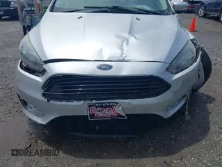 2017 Ford Focus SE with VIN 1FADP3FE4HL295573, listed as a IAAI auction lot 39562568 with 96,939 mi miles and . Bid and sale history available at carsss.com. Image 17.
