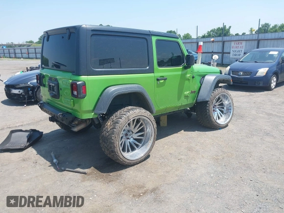 2018 Jeep Wrangler Sport with VIN 1C4GJXAG1JW271695, listed as a IAAI auction lot 42472603 with 105,460 mi miles and . Bid and sale history available at DreamBid. Image 4.