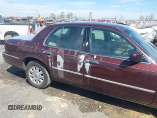 2003 Mercury Grand Marquis LS Premium z VIN 2MEFM75W73X650193, wystawiony jako IAAI lot #41803310 z przebiegiem 151 719 mil mil oraz . Historia ofert i sprzedaży dostępna na DreamBid. Obrazek 6.
