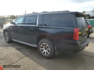 2015 Chevrolet Suburban LT with VIN 1GNSKJKC5FR297522, listed as a Copart auction lot 49248575 with 265,876 mi miles and Clean Title. Bid and sale history available at carsss.com. Image 2.