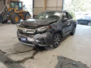 2021 Honda Pilot Touring 8-Passenger with VIN 5FNYF6H95MB048527, listed as a IAAI auction lot 42542138 with 40,584 mi miles and . Bid and sale history available at DreamBid. Image 2.