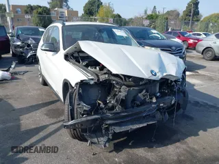 2014 BMW X1 xDrive28i with VIN WBAVL1C52EVY23658, listed as a IAAI auction lot 41153436 with 26,791 mi miles. Bid and sale history available at carsss.com. Image 1.