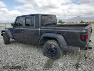 2023 Jeep Gladiator Freedom with VIN 1C6JJTAG9PL557861, listed as a Copart auction lot 50452955 with 44,716 mi miles and Salvage Title. Bid and sale history available at carsss.com. Image 2.