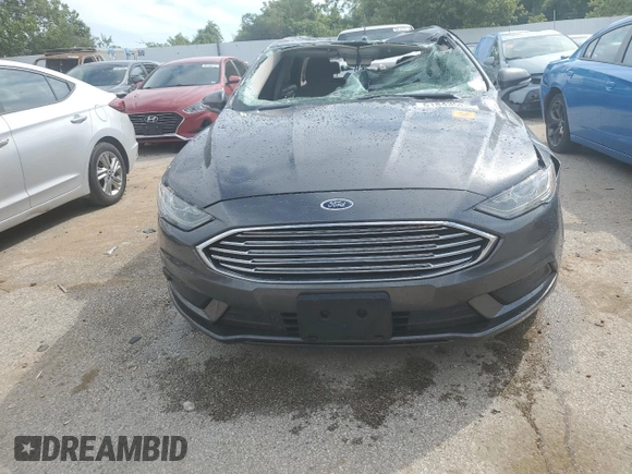 2018 Ford Fusion SE z VIN 3FA6P0H78JR261102, wystawiony jako Copart lot #69963883 z przebiegiem 120 068 mil mil oraz Czysty tytuł • Clean title. Historia ofert i sprzedaży dostępna na DreamBid. Obrazek 5.