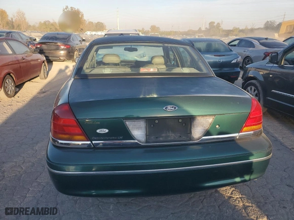 2000 Ford Crown Victoria LX with VIN 2FAFP74W9YX146624, listed as a Copart auction lot 77495074 with 167,594 mi miles and Salvage Title. Bid and sale history available at carsss.com. Image 6.