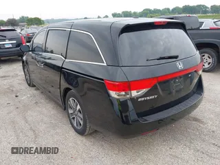 2015 Honda Odyssey Touring Elite with VIN 5FNRL5H97FB124565, listed as a IAAI auction lot 42358412 with 206,444 mi miles and . Bid and sale history available at DreamBid. Image 3.