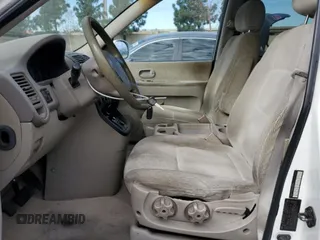 2005 Kia Sedona LX with VIN KNDUP132356623195, listed as a Copart auction lot 46623545 with 173,049 mi miles and Salvage Title. Bid and sale history available at carsss.com. Image 7.