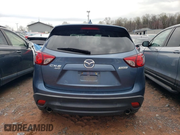 2016 Mazda CX-5 Grand Touring with VIN JM3KE4DY7G0761594, listed as a Copart auction lot 51514595 with 58,250 mi miles and Salvage Title. Bid and sale history available at DreamBid. Image 6.