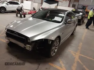 2015 Jaguar XJ with VIN SAJWA1CZ8F8V83873, listed as a IAAI auction lot 41271111 with 94,830 mi miles. Bid and sale history available at carsss.com. Image 2.