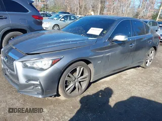 2019 Infiniti Q50 Luxe z VIN JN1EV7AR2KM590794, wystawiony jako IAAI lot #40841640 z przebiegiem 68 720 mil mil oraz . Historia ofert i sprzedaży dostępna na DreamBid. Obrazek 18.