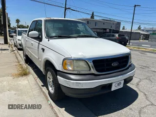 2001 Ford F-150 XLT with VIN 1FTRW07L11KF90642, listed as a Copart auction lot 64489205 with 242,959 mi miles and Salvage title. Bid and sale history available at DreamBid. Image 1.