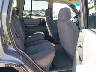 1996 Jeep Grand Cherokee with VIN 1J4EZ58S5TC149533, listed as a IAAI auction lot 42456529 with 173,872 mi miles and . Bid and sale history available at DreamBid. Image 8.