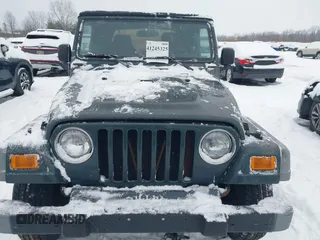 2004 Jeep Wrangler SE with VIN 1J4FA29154P778915, listed as a IAAI auction lot 41245325 with 205,852 mi miles and . Bid and sale history available at DreamBid. Image 6.