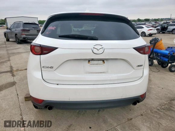 2018 Mazda CX-5 Touring z VIN JM3KFACM0J0469433, wystawiony jako Copart lot #54349955 z przebiegiem Nie podano mil oraz Szkoda całkowita • Salvage title. Historia ofert i sprzedaży dostępna na DreamBid. Obrazek 6.