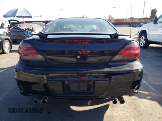 2002 Pontiac Grand Am GT with VIN 1G2NW52E12M704539, listed as a Copart auction lot 73755214 with 100,904 mi miles and Clean Title. Bid and sale history available at carsss.com. Image 6.