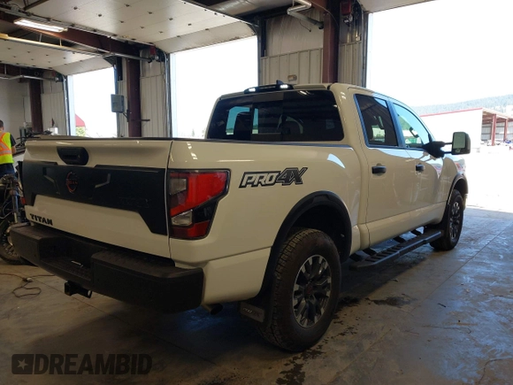 2024 Nissan Titan Pro-4X with VIN 1N6AA1ED0RN112314, listed as a IAAI auction lot 42465520 with 8,711 mi miles and . Bid and sale history available at DreamBid. Image 4.