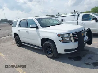 2020 Chevrolet Tahoe Commercial z VIN 1GNSKDEC7LR261064, wystawiony jako IAAI lot #42507318 z przebiegiem 129 236 mil mil oraz . Historia ofert i sprzedaży dostępna na DreamBid. Obrazek 1.