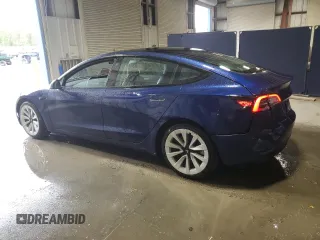 2022 Tesla Model 3 with VIN 5YJ3E1EA7NF369551, listed as a Copart auction lot 55610805 with 128,311 mi miles and Clean Title. Bid and sale history available at DreamBid. Image 2.