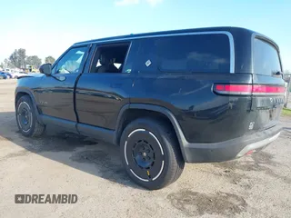 2025 Rivian R1S Adventure with VIN 7PDSGBBAXSN055849, listed as a IAAI auction lot 41255282 with 2,885 mi miles. Bid and sale history available at carsss.com. Image 3.