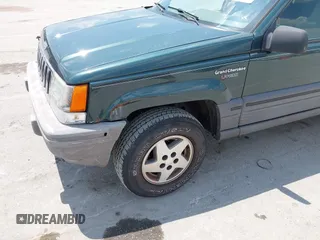 1995 Jeep Grand Cherokee Laredo with VIN 1J4FX58S0SC716398, listed as a IAAI auction lot 42647346 with 58,184 mi miles and . Bid and sale history available at DreamBid. Image 6.