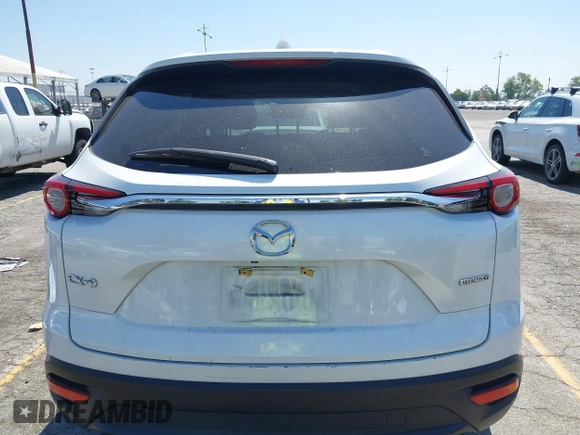 2020 Mazda CX-9 Sport with VIN JM3TCABY1L0406720, listed as a IAAI auction lot 42304144 with 75,887 mi miles and . Bid and sale history available at DreamBid. Image 16.