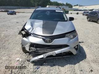 2018 Toyota RAV4 XLE with VIN 2T3WFREVXJW427748, listed as a Copart auction lot 61833055 with 104,057 mi miles and Salvage title. Bid and sale history available at DreamBid. Image 5.
