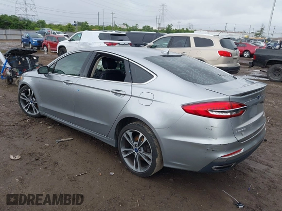 2020 Ford Fusion Titanium with VIN 3FA6P0D98LR115437, listed as a IAAI auction lot 42331052 with 127,346 mi miles and . Bid and sale history available at DreamBid. Image 3.