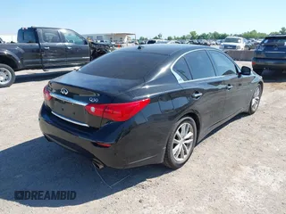 2014 Infiniti Q50 Premium z VIN JN1BV7AP2EM672661, wystawiony jako IAAI lot #42319325 z przebiegiem 85 803 mil mil oraz . Historia ofert i sprzedaży dostępna na DreamBid. Obrazek 4.