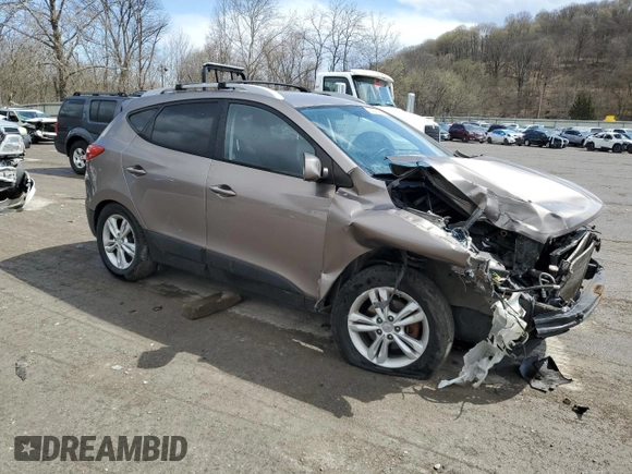 2011 Hyundai Tucson Limited with VIN KM8JUCAC2BU200517, listed as a Copart auction lot 53252005 with 158,502 mi miles and Salvage Title. Bid and sale history available at DreamBid. Image 4.