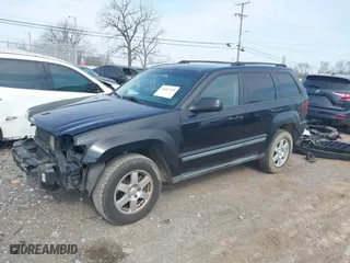 2009 Jeep Grand Cherokee Laredo with VIN 1J8GS48K59C548330, listed as a IAAI auction lot 41887548 with 184,434 mi miles. Bid and sale history available at carsss.com. Image 2.