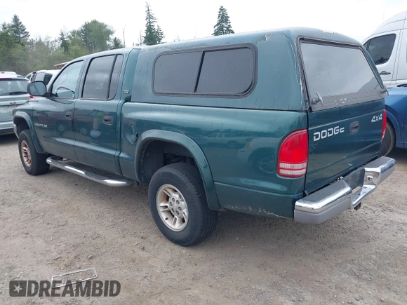2000 Dodge Dakota Sport z VIN 1B7GG2AN4YS760836, wystawiony jako IAAI lot #42472312 z przebiegiem 230 401 mil mil oraz . Historia ofert i sprzedaży dostępna na DreamBid. Obrazek 3.