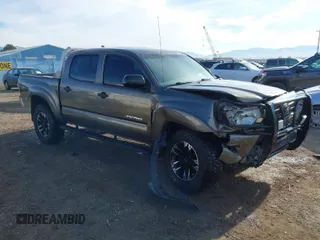 2014 Toyota Tacoma with VIN 3TMLU4EN3EM143882, listed as a IAAI auction lot 40657975 with 125,008 mi miles. Bid and sale history available at carsss.com. Image 1.