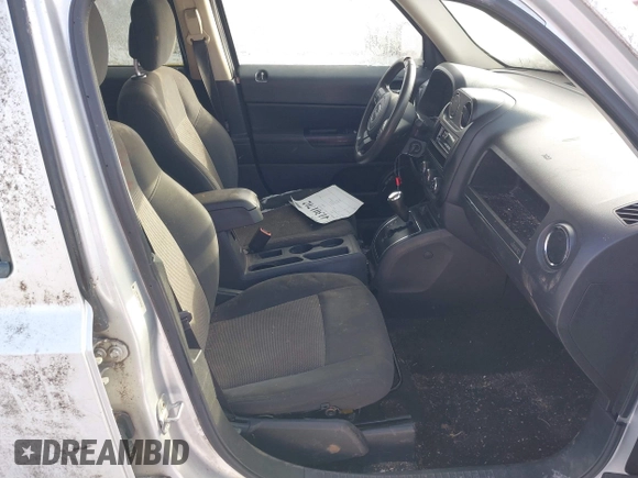 2011 Jeep Patriot Latitude with VIN 1J4NT1GBXBD289758, listed as a IAAI auction lot 41301702 with 215,068 mi miles. Bid and sale history available at carsss.com. Image 5.