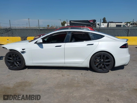 2023 Tesla Model S with VIN 5YJSA1E59PF500816, listed as a IAAI auction lot 42409049 with Not provided miles and . Bid and sale history available at DreamBid. Image 14.