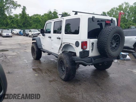 2014 Jeep Wrangler Unlimited Rubicon with VIN 1C4HJWFG4EL104827, listed as a IAAI auction lot 42236622 with 90,935 mi miles and . Bid and sale history available at DreamBid. Image 3.