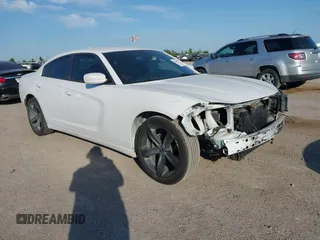 2015 Dodge Charger SXT with VIN 2C3CDXHG8FH730145, listed as a IAAI auction lot 42039927 with 156,135 mi miles and . Bid and sale history available at DreamBid. Image 1.