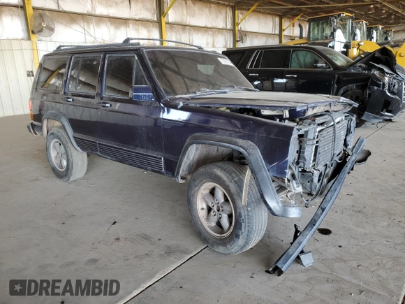 1996 Jeep Cherokee Sport with VIN 1J4FT68S1TL275271, listed as a Copart auction lot 72701214 with 235,651 mi miles and Salvage Title. Bid and sale history available at carsss.com. Image 4.