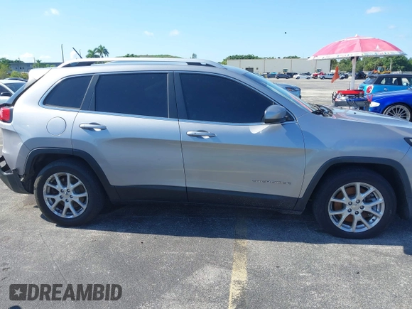 2014 Jeep Cherokee Latitude with VIN 1C4PJLCS6EW103423, listed as a IAAI auction lot 40118289 with 112,120 mi miles and . Bid and sale history available at DreamBid. Image 13.