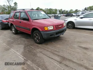 1998 Isuzu Rodeo S z VIN 4S2CK58WXW4325645, wystawiony jako IAAI lot #42013228 z przebiegiem 300 698 mil mil oraz . Historia ofert i sprzedaży dostępna na DreamBid. Obrazek 1.