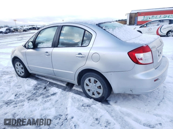 2010 Suzuki SX4 LE with VIN JS2YC5A25A6300970, listed as a Copart auction lot 81596084 with 142,083 mi miles and Salvage Title. Bid and sale history available at carsss.com. Image 2.