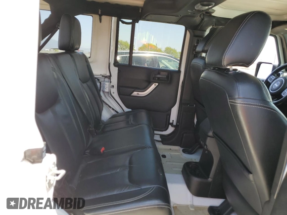 2015 Jeep Wrangler Unlimited Rubicon with VIN 1C4BJWFG6FL508493, listed as a Copart auction lot 54788635 with 127,694 mi miles and Salvage title. Bid and sale history available at DreamBid. Image 11.