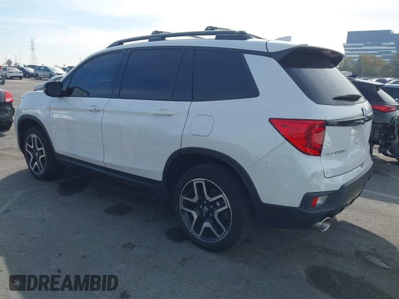 2023 Honda Passport Elite with VIN 5FNYF8H07PB010220, listed as a IAAI auction lot 41675730 with 25,128 mi miles and . Bid and sale history available at DreamBid. Image 3.