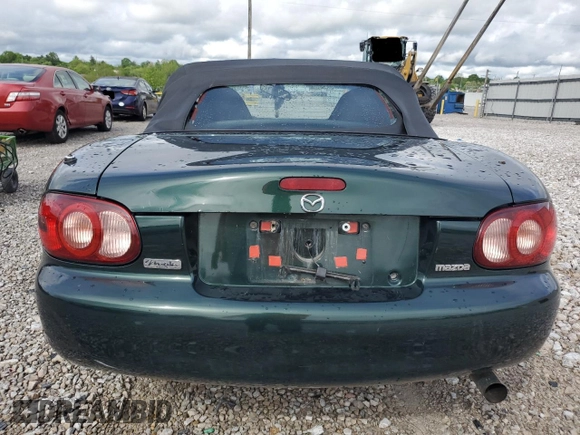 2001 Mazda MX-5 Miata z VIN JM1NB353610200693, wystawiony jako Copart lot #55385725 z przebiegiem 98 777 mil mil oraz Szkoda całkowita • Salvage title. Historia ofert i sprzedaży dostępna na DreamBid. Obrazek 6.