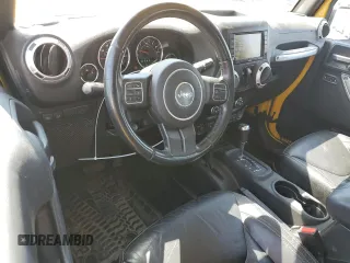 2015 Jeep Wrangler Rubicon Hard Rock with VIN 1C4BJWCG6FL568665, listed as a Copart auction lot 60282155 with 107,773 mi miles and Salvage title. Bid and sale history available at DreamBid. Image 8.
