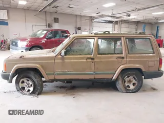 1999 Jeep Cherokee Sport with VIN 1J4FF68S0XL506805, listed as a IAAI auction lot 42663325 with 317,008 mi miles and . Bid and sale history available at DreamBid. Image 12.