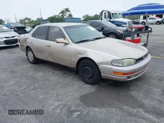 1994 Toyota Camry LE with VIN 4T1SK12E1RU468287, listed as a IAAI auction lot 41874676 with 117,751 mi miles. Bid and sale history available at carsss.com. Image 1.