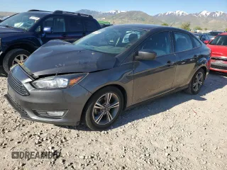 2018 Ford Focus SE z VIN 1FADP3FE8JL230215, wystawiony jako Copart lot #56307885 z przebiegiem 99 943 mil mil oraz Szkoda całkowita • Salvage title. Historia ofert i sprzedaży dostępna na DreamBid. Obrazek 1.