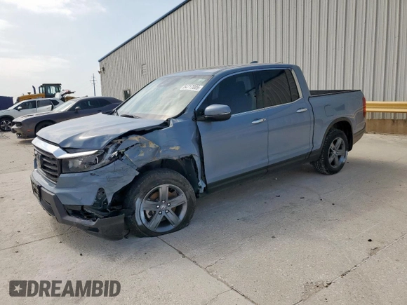 2023 Honda Ridgeline RTL-E with VIN 5FPYK3F76PB036572, listed as a Copart auction lot 54717085 with 34,516 mi miles and Salvage title. Bid and sale history available at DreamBid. Image 1.